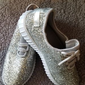 Silver colored sneakers